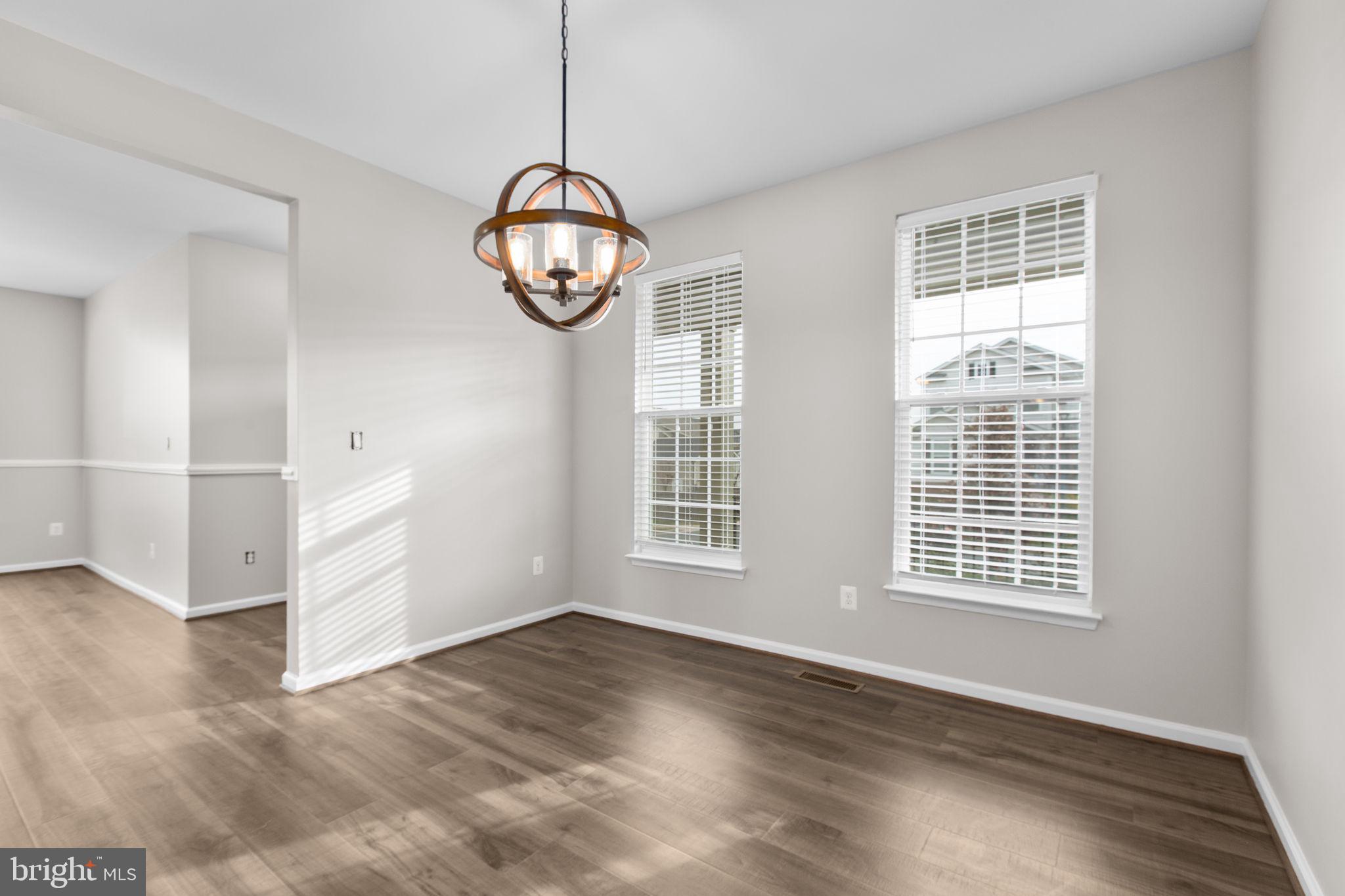 930 Forsythia Lane Stafford, VA 22554 - Photo 9 of 81 a view of an empty room with wooden floor and window