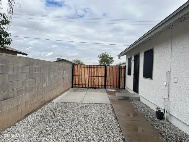 a view of a pathway both side of house
