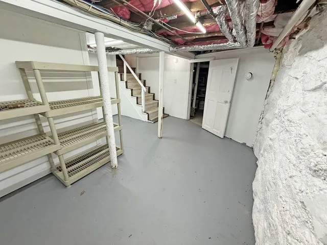 a view of an empty room with stairs