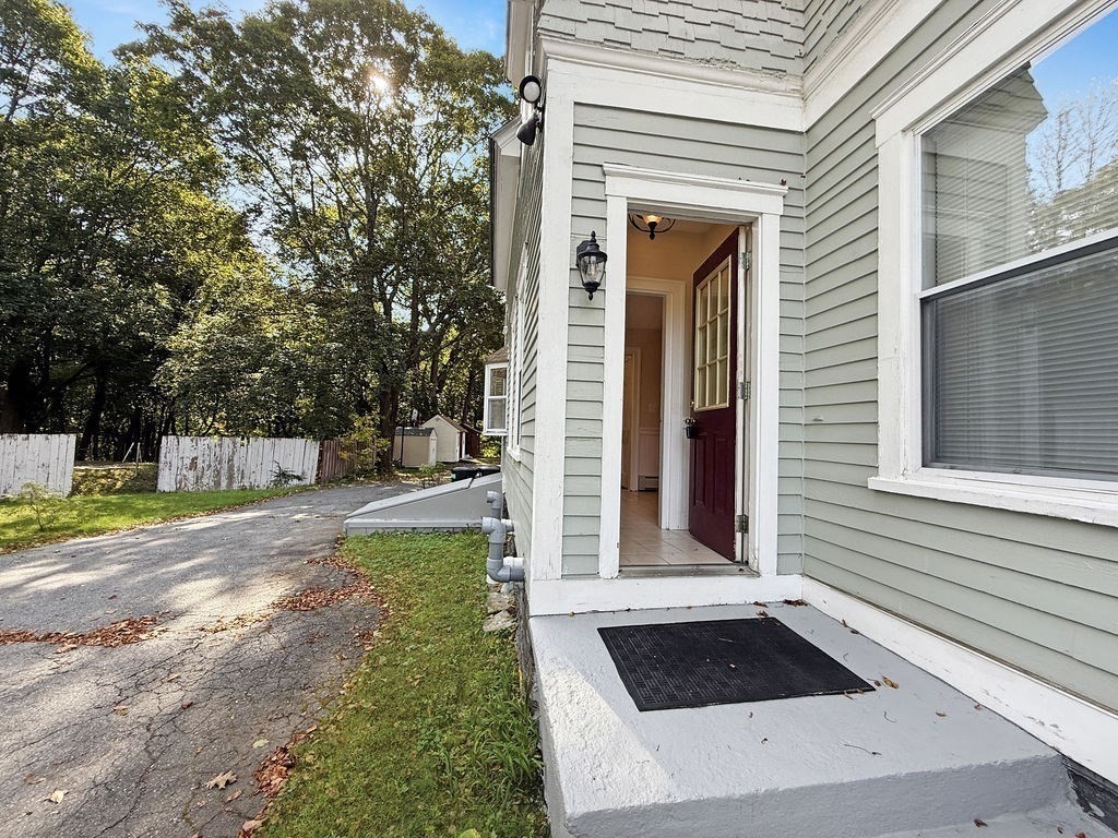 52 Littleton Road, Unit 1 Chelmsford, MA 01824 - Photo 40 of 40 a view of a house with backyard and sitting area