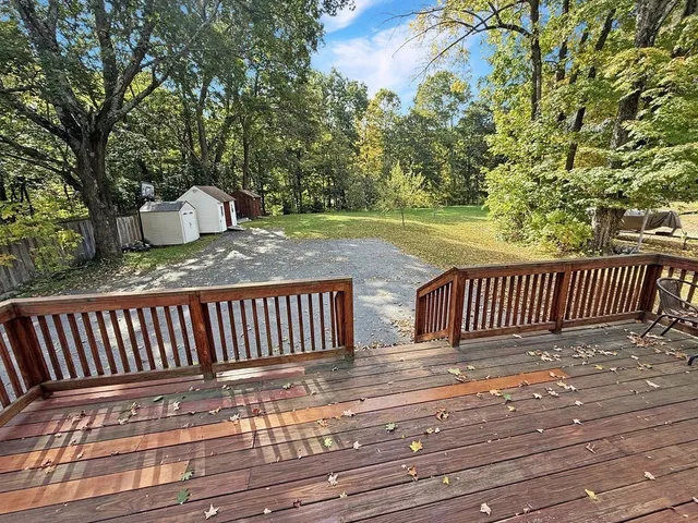 a view of a wooden deck with a bench