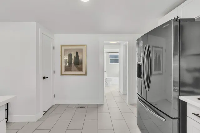 a kitchen with refrigerator cabinets and a counter top space