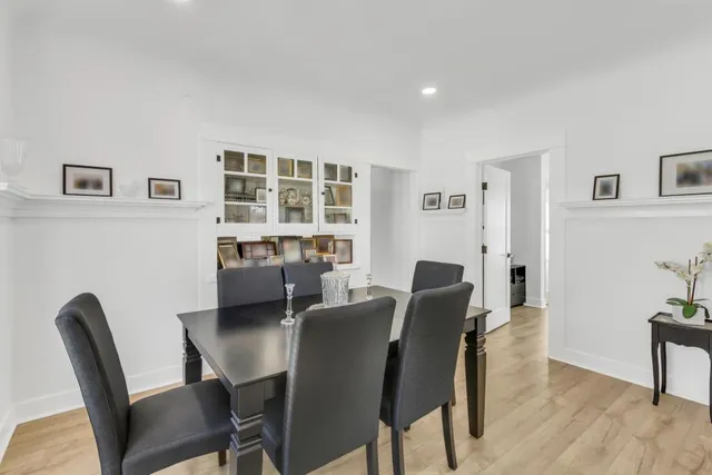 a view of a dining room with furniture and window