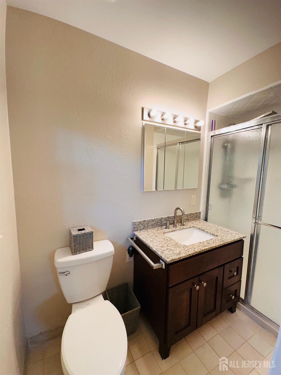 667 Cedarbrook Road Bridgewater, NJ 08807 - Photo 15 of 24 a bathroom with a sink and a mirror