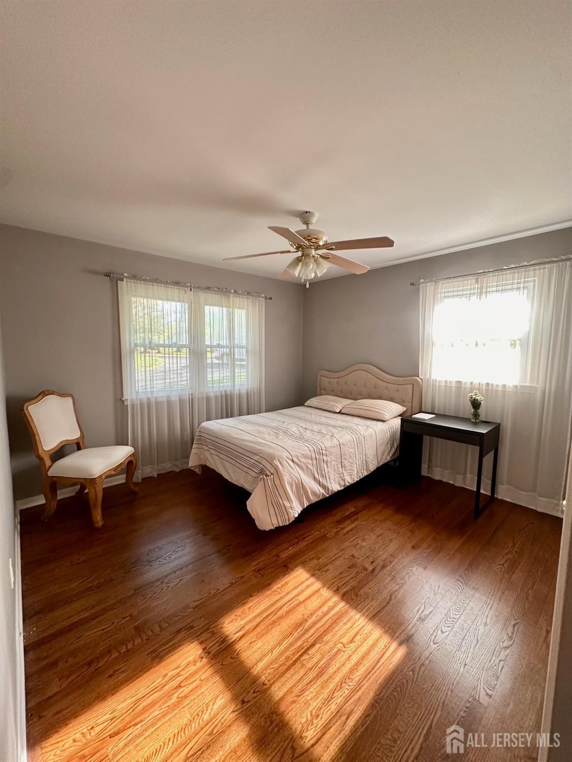 667 Cedarbrook Road Bridgewater, NJ 08807 - Photo 16 of 24 a bedroom with a bed and a chair