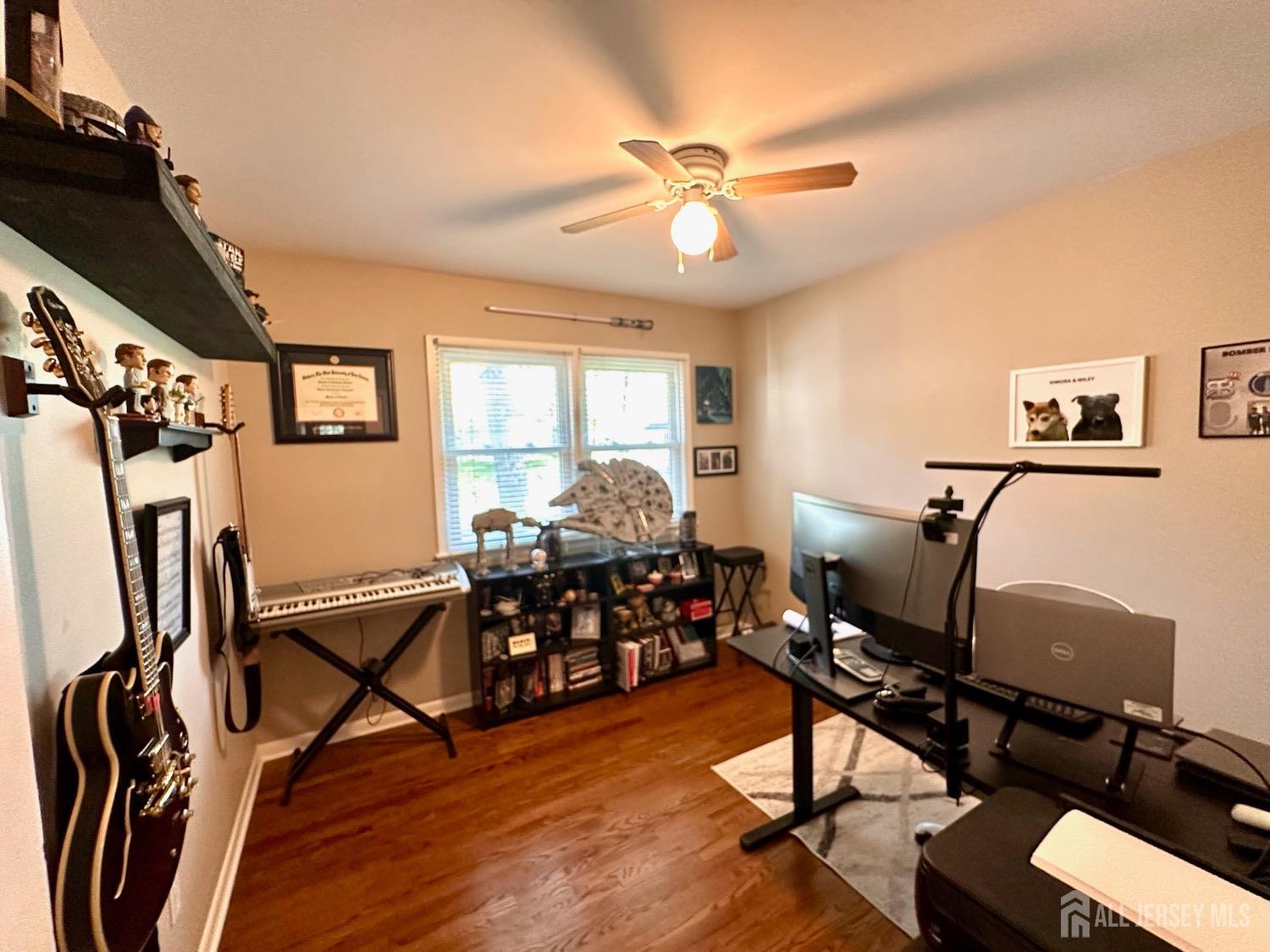 667 Cedarbrook Road Bridgewater, NJ 08807 - Photo 17 of 24 a view of a workspace with furniture window and wooden floor