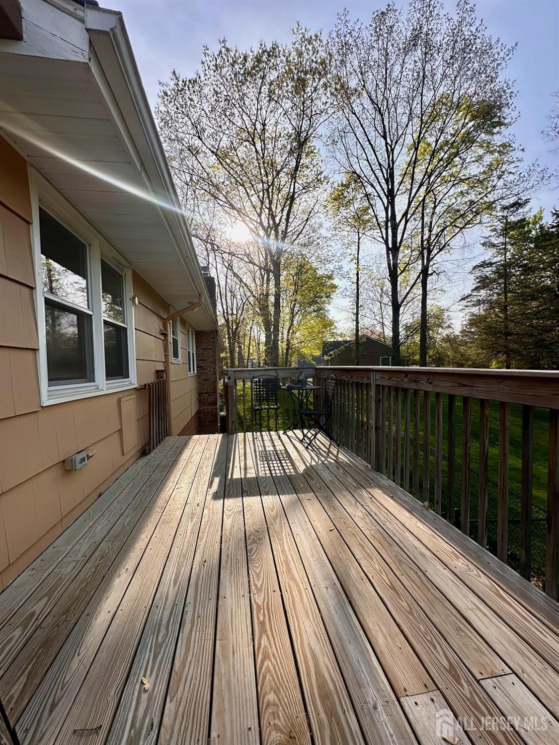 667 Cedarbrook Road Bridgewater, NJ 08807 - Photo 24 of 24 a view of balcony with wooden floor and fence