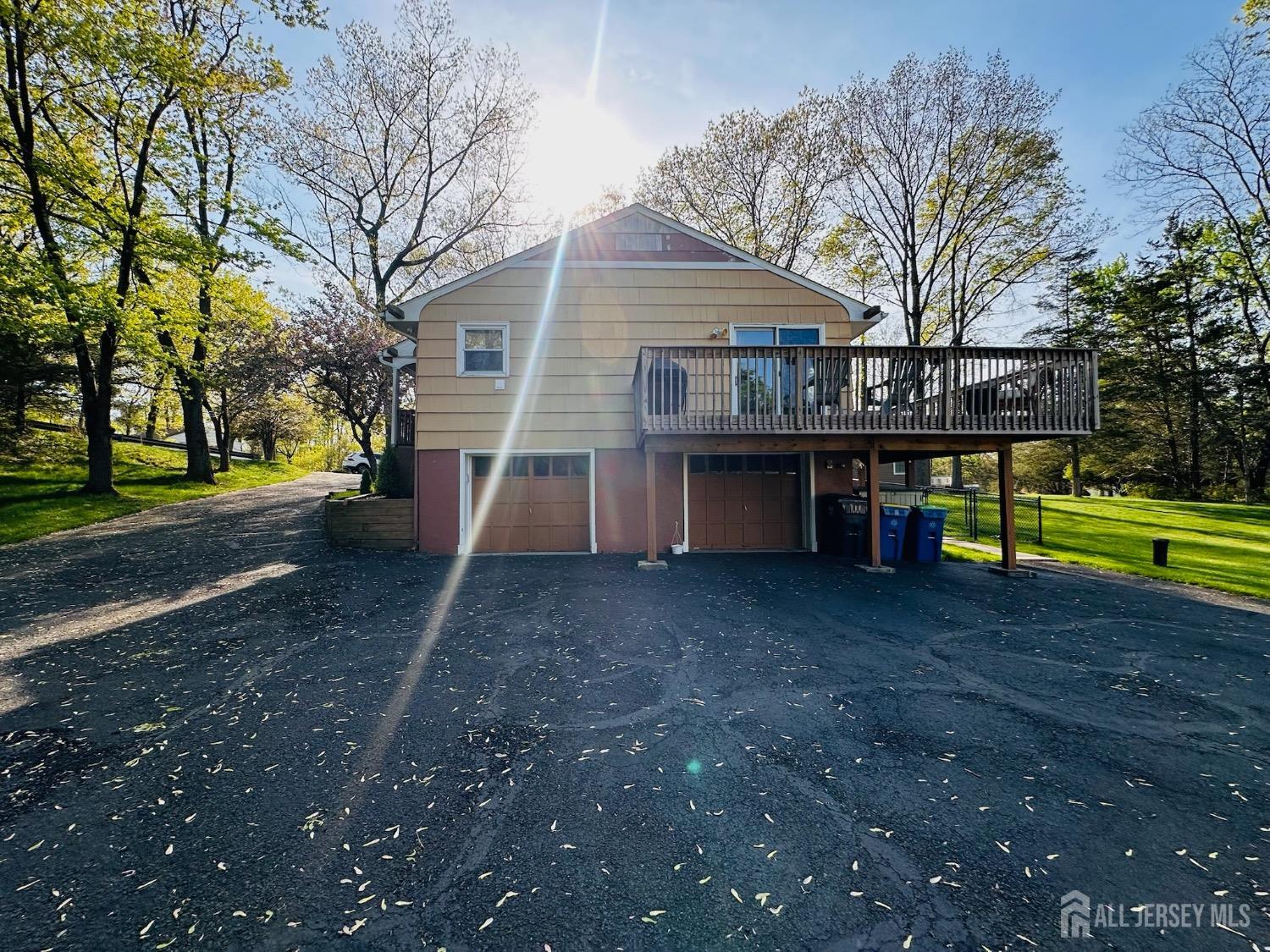 667 Cedarbrook Road Bridgewater, NJ 08807 - Photo 5 of 24 a view of a house with a yard and sitting area