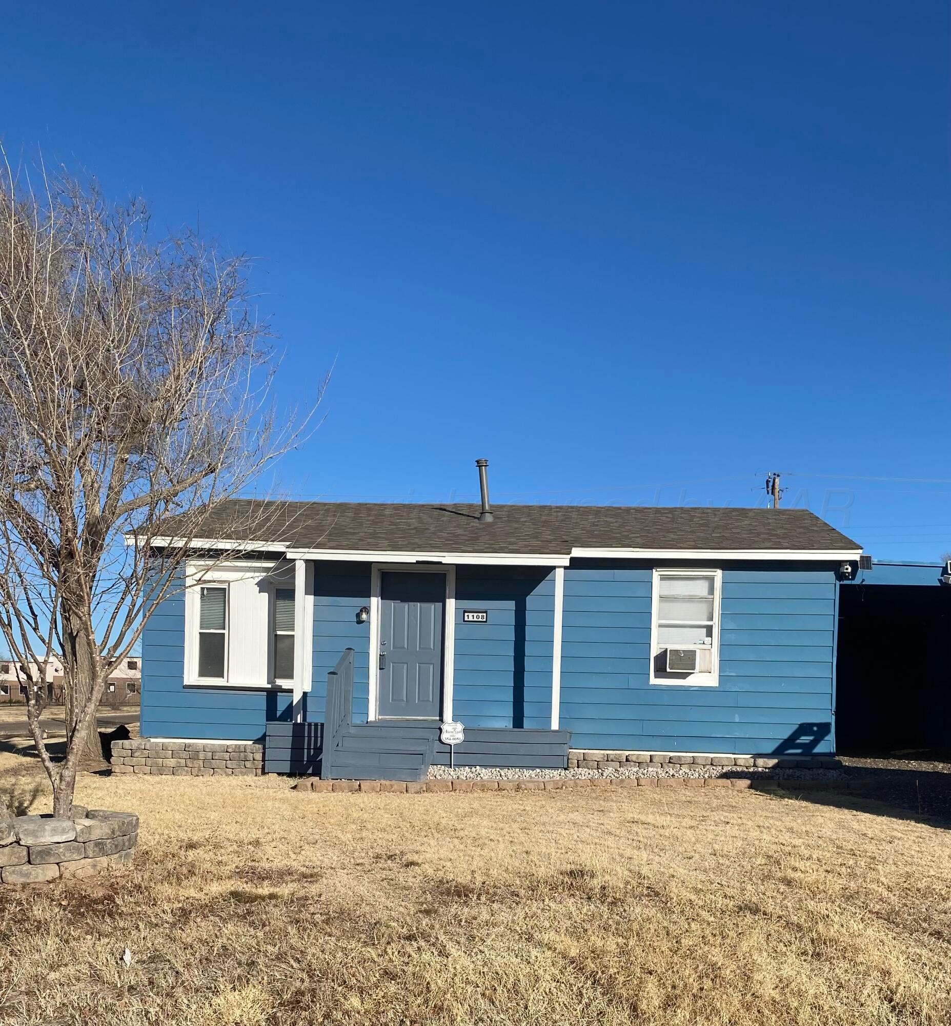 1108 North Madison Street Amarillo, TX 79107 - Photo 1 of 21 front view of a house with a yard