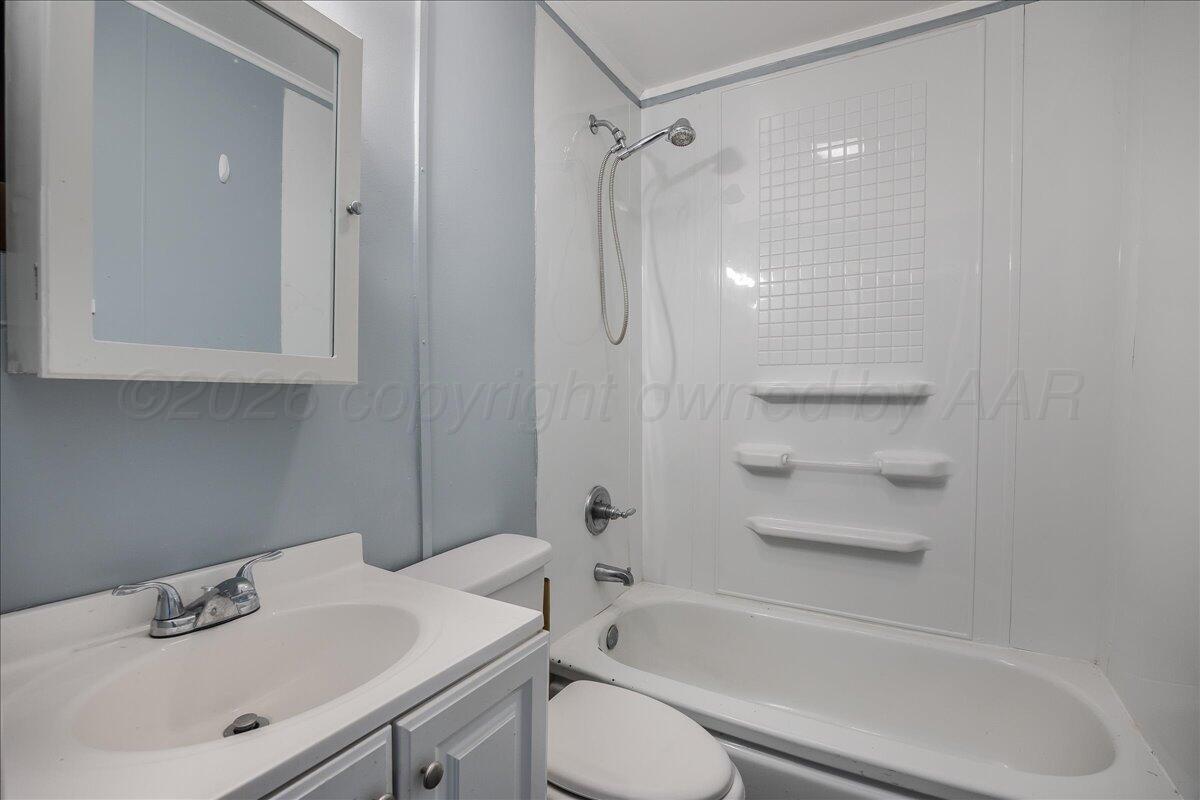 1108 North Madison Street Amarillo, TX 79107 - Photo 14 of 21 a bathroom with a sink toilet and shower