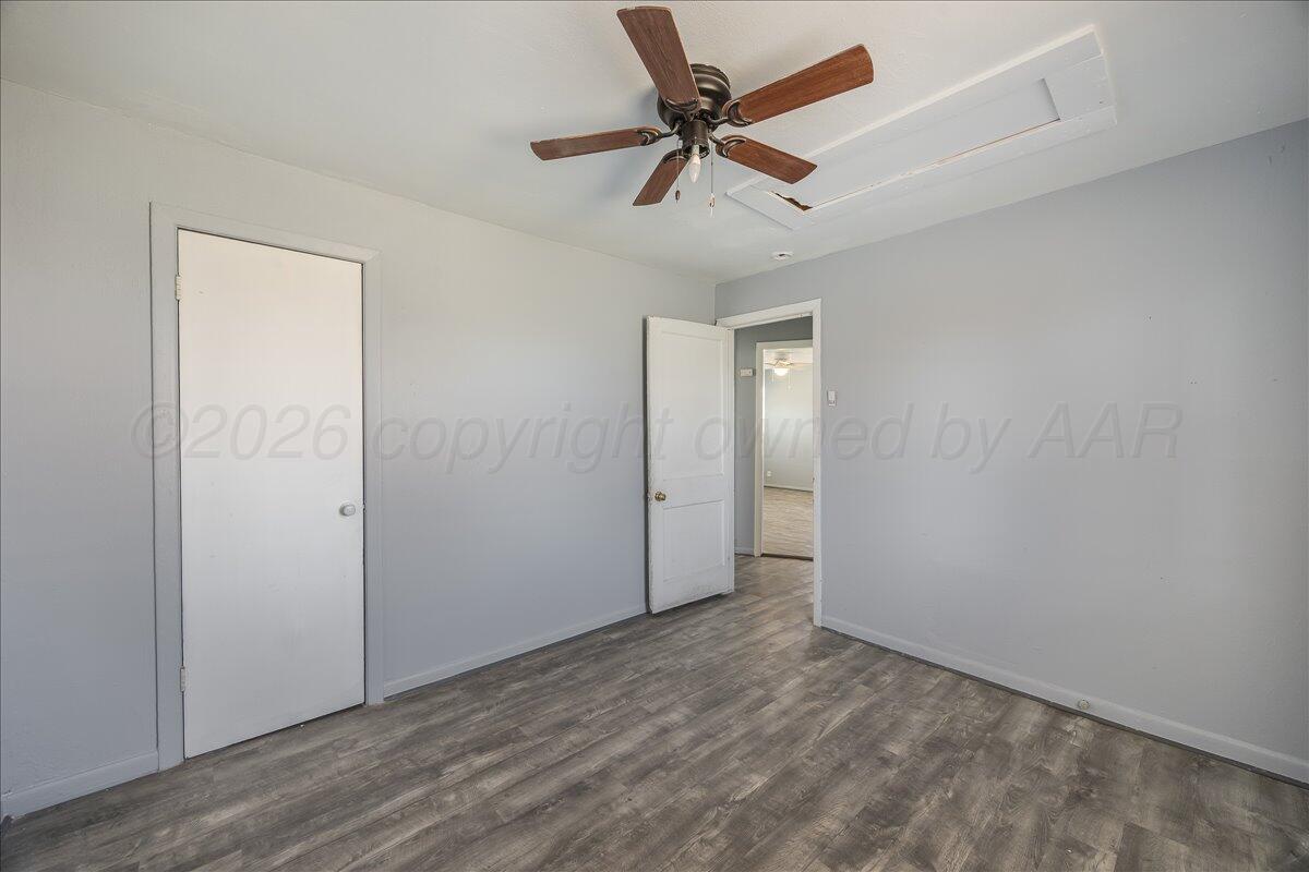 1108 North Madison Street Amarillo, TX 79107 - Photo 14 of 22 wooden floor in an empty room