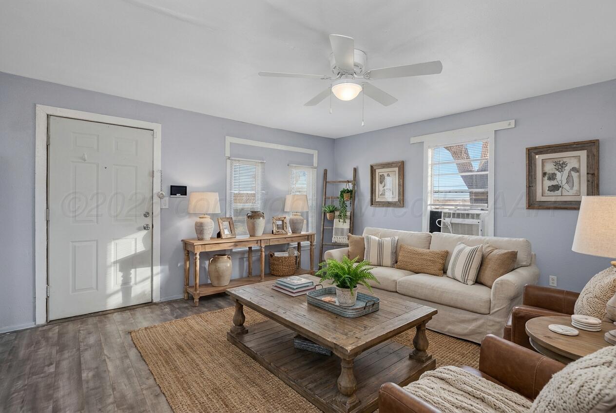 1108 North Madison Street Amarillo, TX 79107 - Photo 5 of 22 a living room with furniture and a wooden floor
