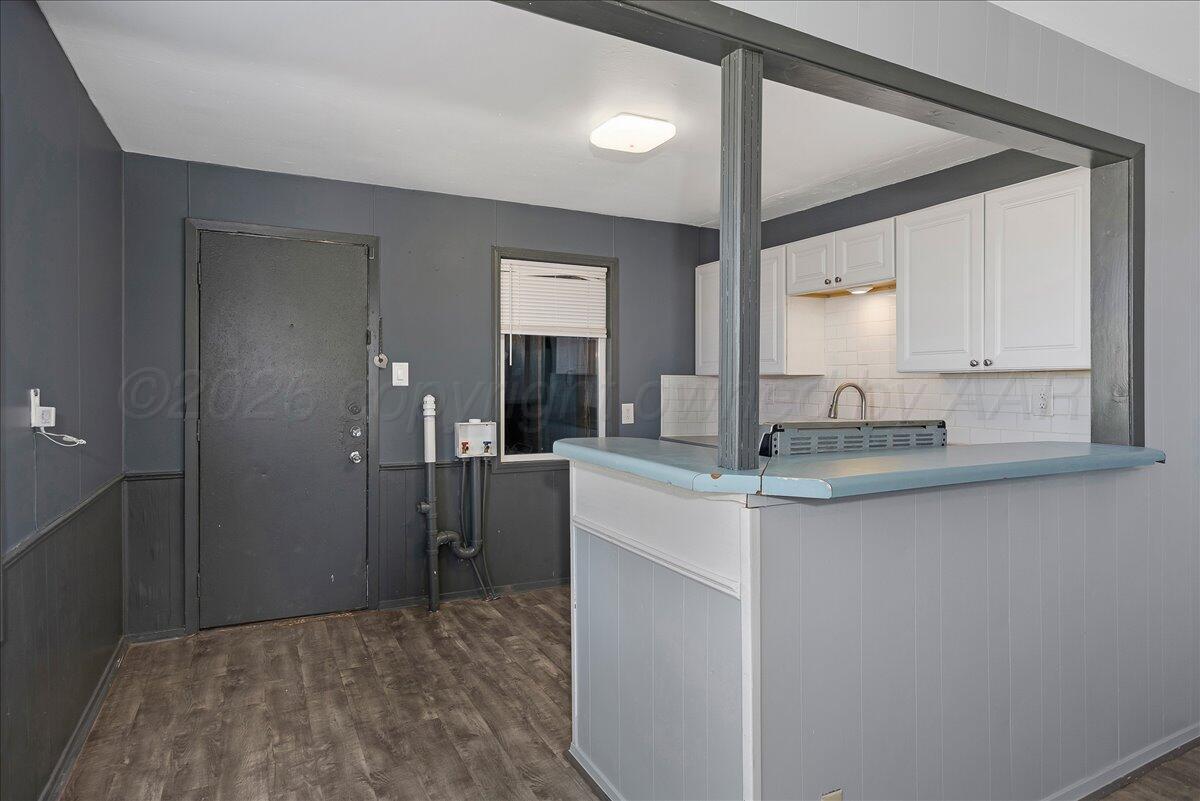 1108 North Madison Street Amarillo, TX 79107 - Photo 8 of 22 a kitchen with stainless steel appliances granite countertop a sink and cabinets