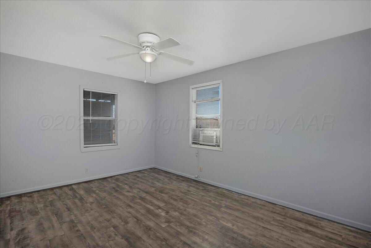 1108 North Madison Street Amarillo, TX 79107 - Photo 10 of 22 a view of a room with a ceiling fan and window
