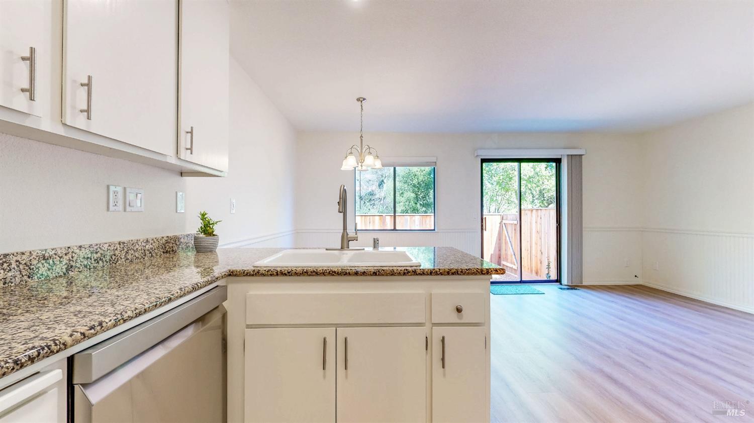 158 North Dutton Avenue Santa Rosa, CA 95401 - Photo 19 of 50 a kitchen with granite countertop stainless steel appliances sink and cabinets