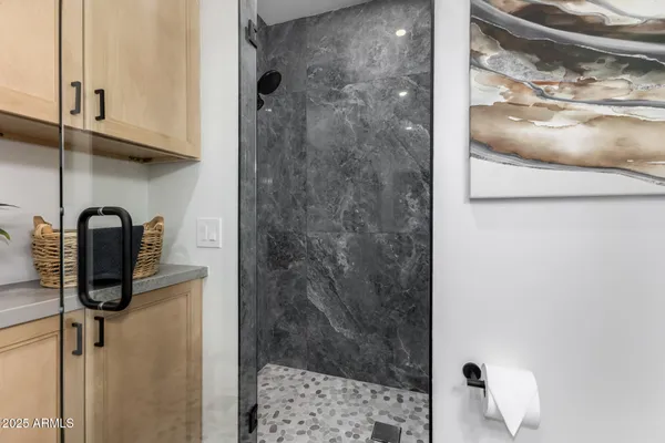a bathroom with a double vanity sink and a mirror
