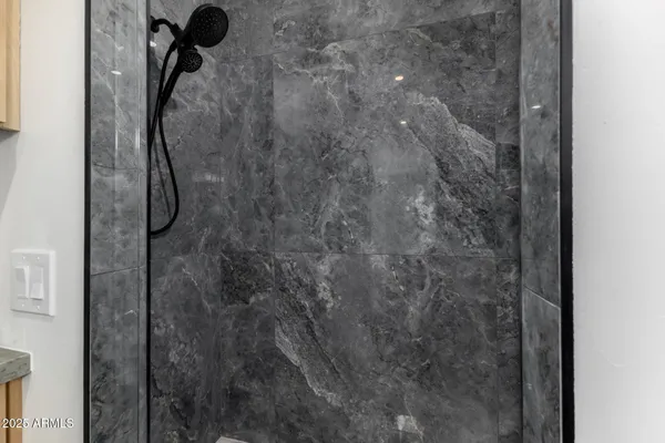 a bathroom with a double vanity sink toilet and shower