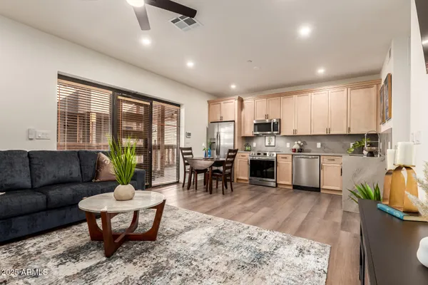 a living room with furniture and a fireplace