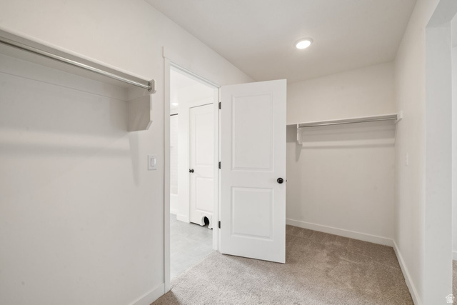 70 East Weekes Way Clearfield, UT 84015 - Photo 11 of 25 Walk in closet featuring light carpet