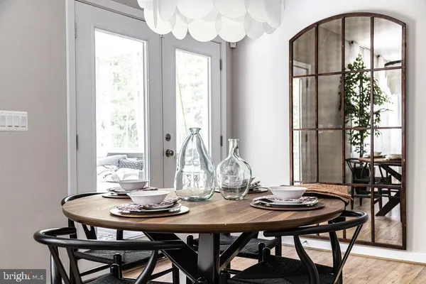 a view of a dining room with furniture and window