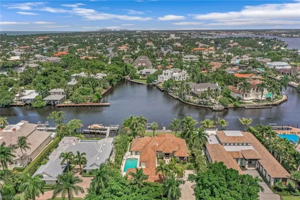 an aerial view of a house with a lake view