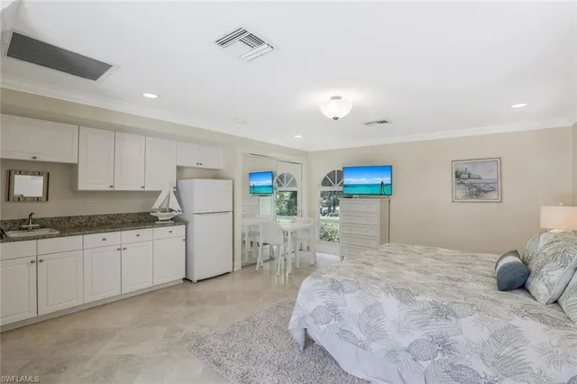 a bedroom with a bed and a cabinets
