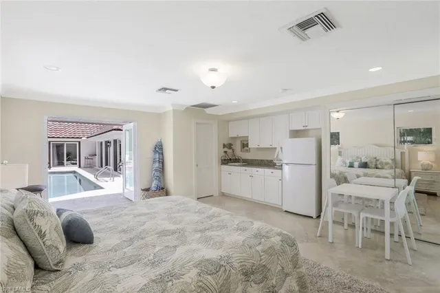 a large white bed in a white room