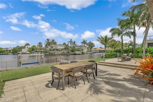 a view of a lake with outdoor seating