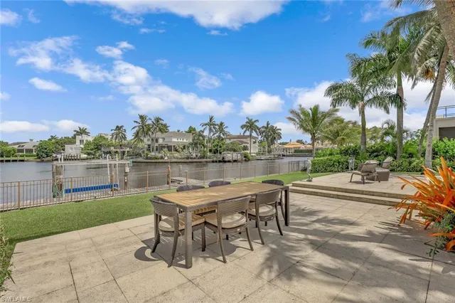 a view of a lake with outdoor seating