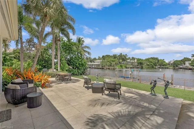 a view of a lake with outdoor seating