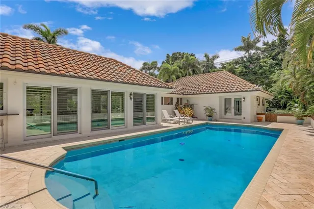 a front view of house with yard and outdoor seating