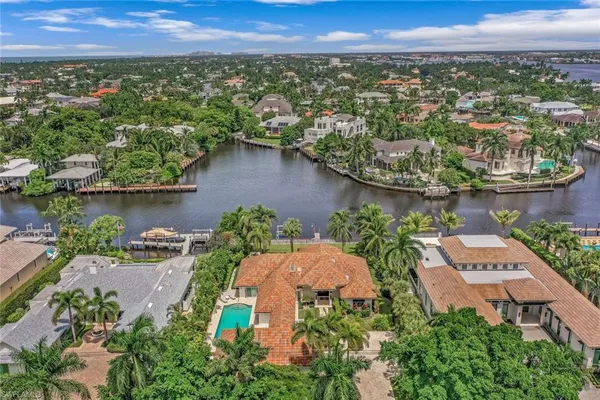 an aerial view of a house with a lake view