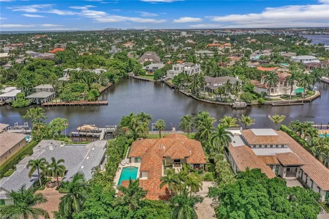 an aerial view of a house with a lake view