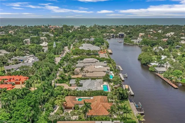 an aerial view of a houses with a lake view