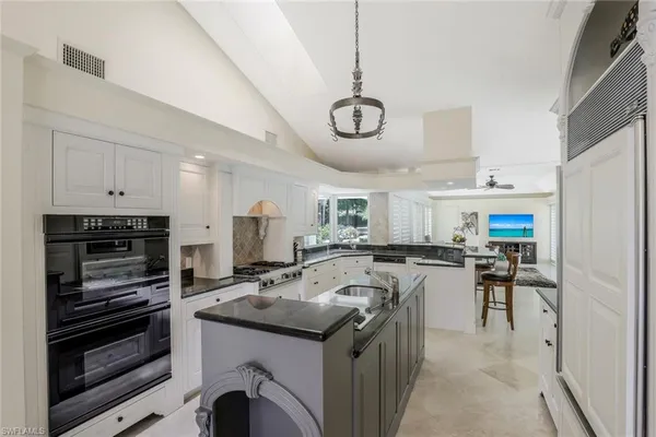 a kitchen with a stove and a refrigerator