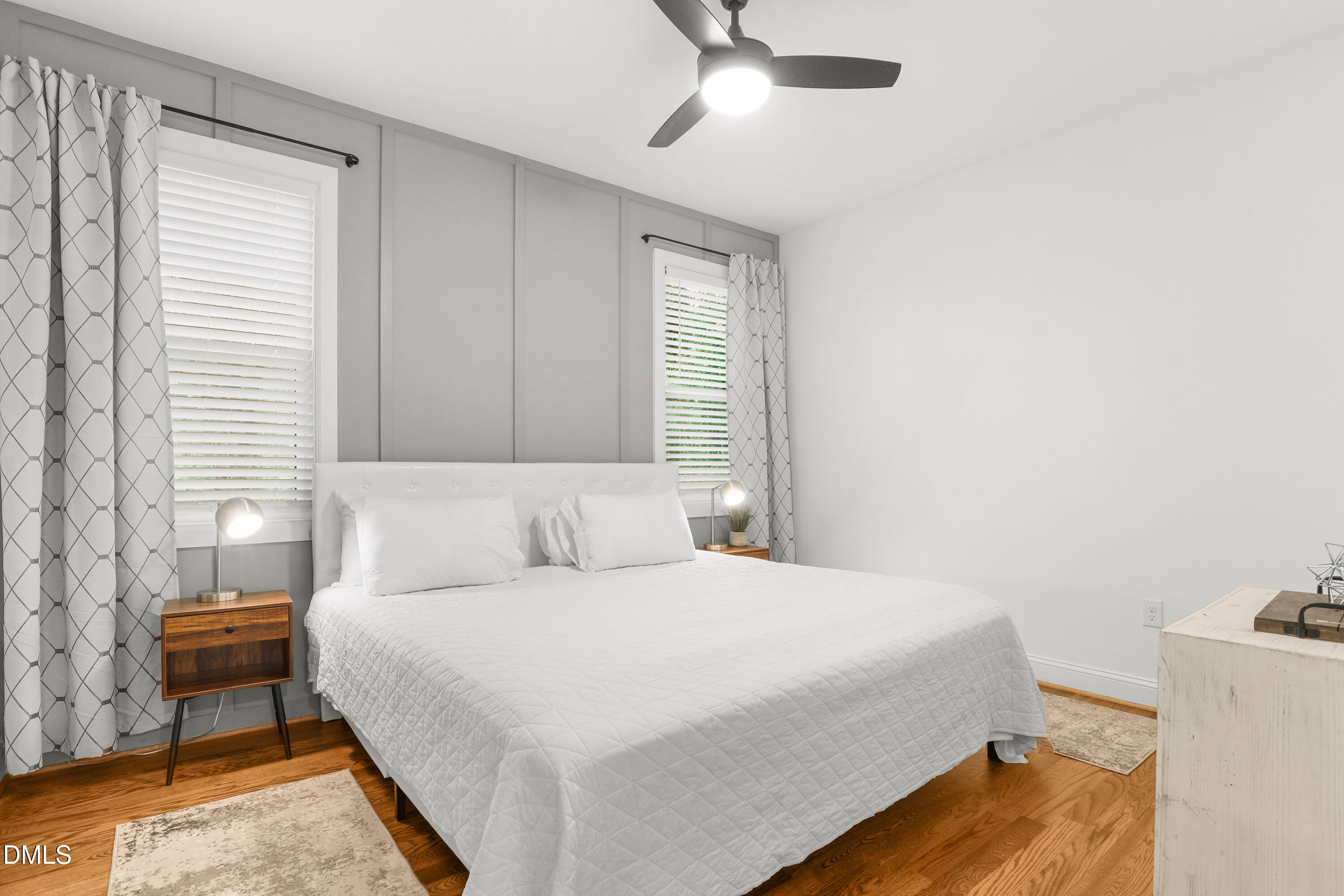 1217 Rosedale Avenue, Unit B Durham, NC 27707 - Photo 12 of 24 a bedroom with a bed and a chandelier