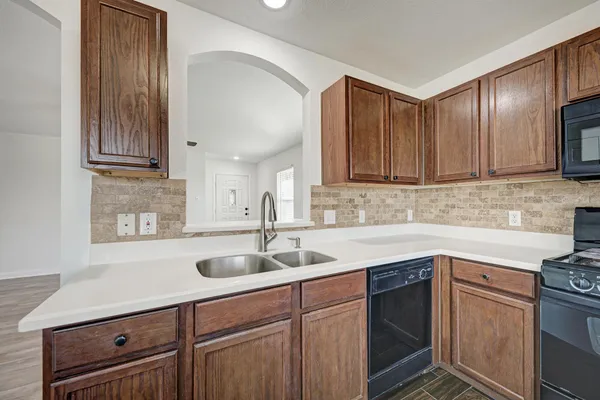 a kitchen with a sink and cabinets