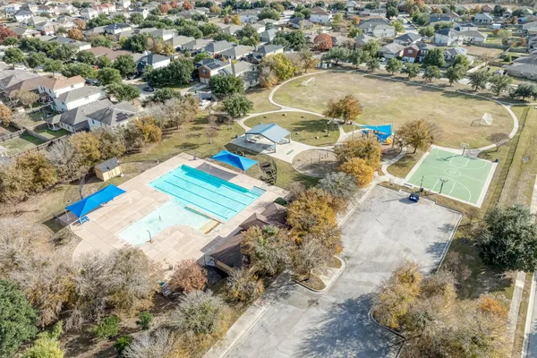 a view of a swimming pool with lounge chair