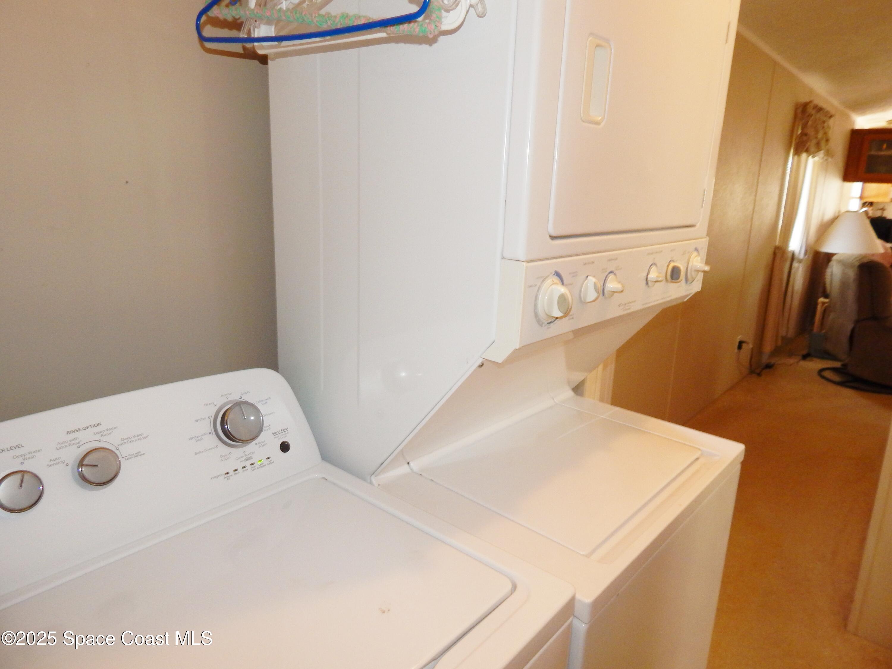 3016 Indian River Drive Northeast Palm Bay, FL 32905 - Photo 19 of 27 a utility room with dryer and washer