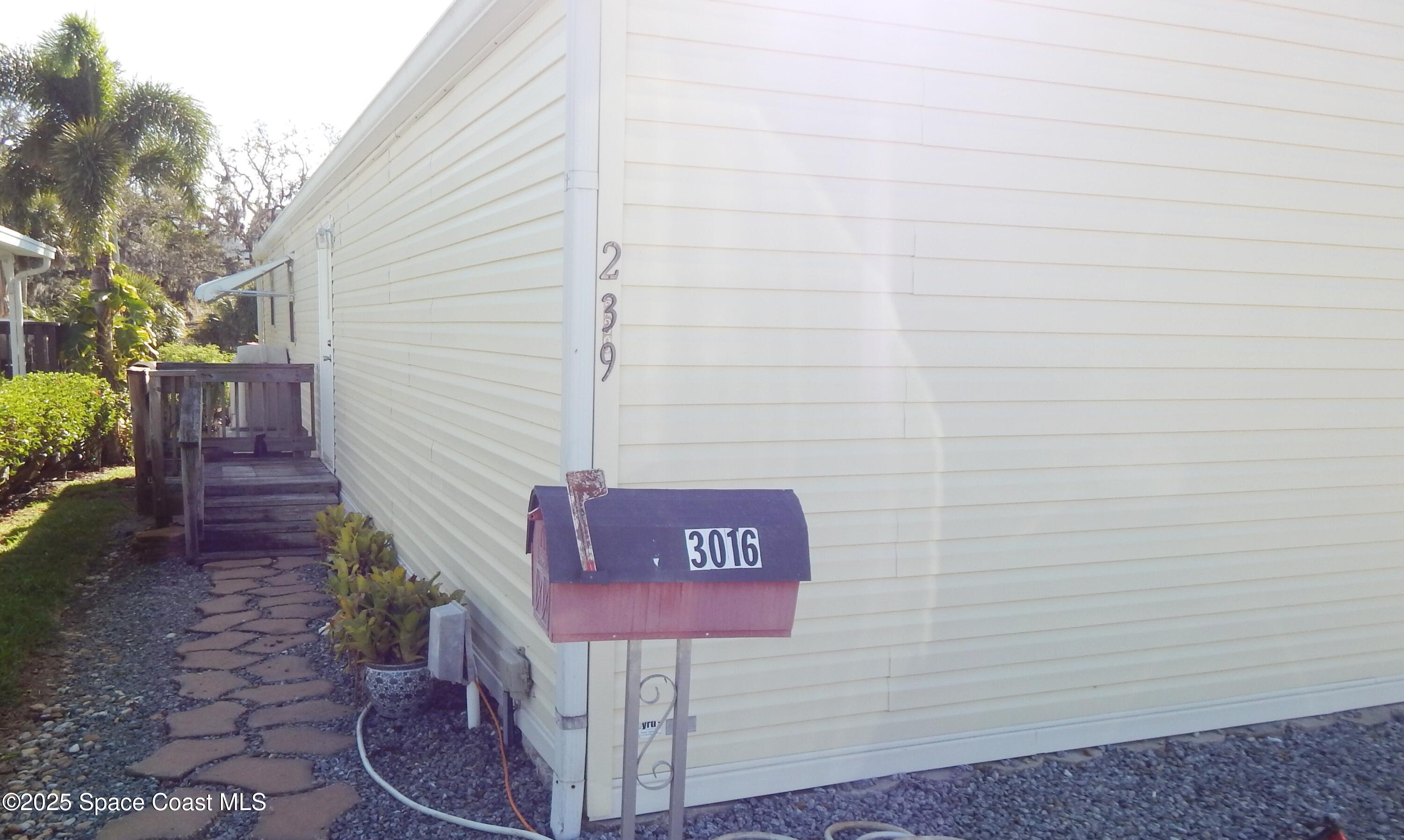 3016 Indian River Drive Northeast Palm Bay, FL 32905 - Photo 2 of 27 a sign that is on a brick wall