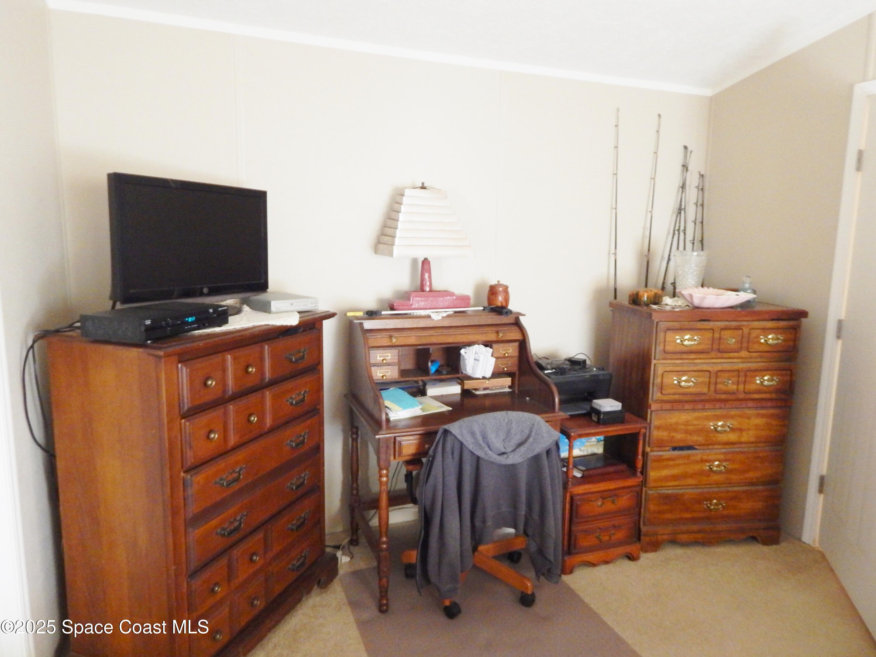 3016 Indian River Drive Northeast Palm Bay, FL 32905 - Photo 21 of 27 a view of a workspace with furniture