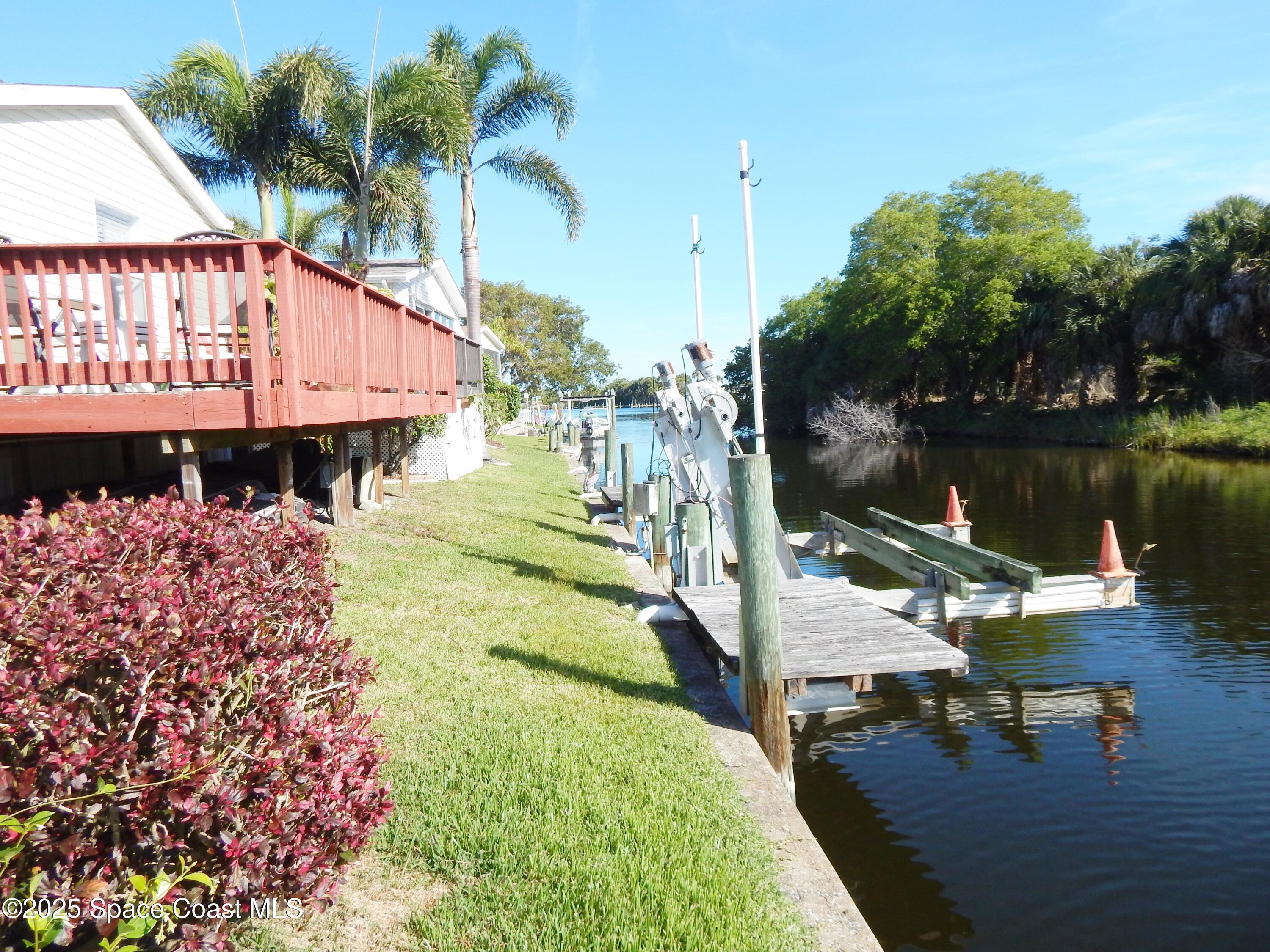 3016 Indian River Drive Northeast Palm Bay, FL 32905 - Photo 5 of 27 a view of a lake with a patio