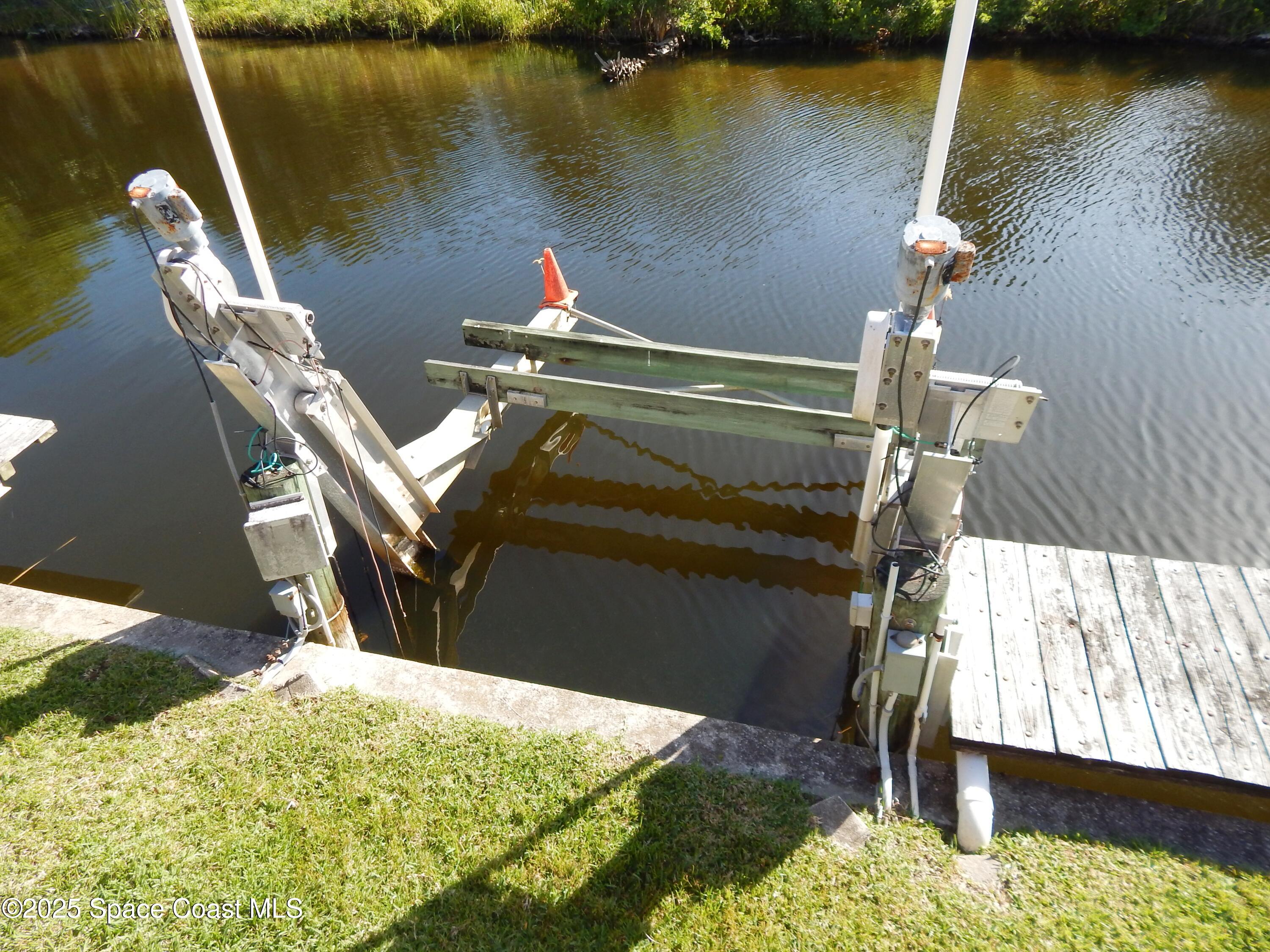 3016 Indian River Drive Northeast Palm Bay, FL 32905 - Photo 10 of 27 a terrace with outdoor seating and water view