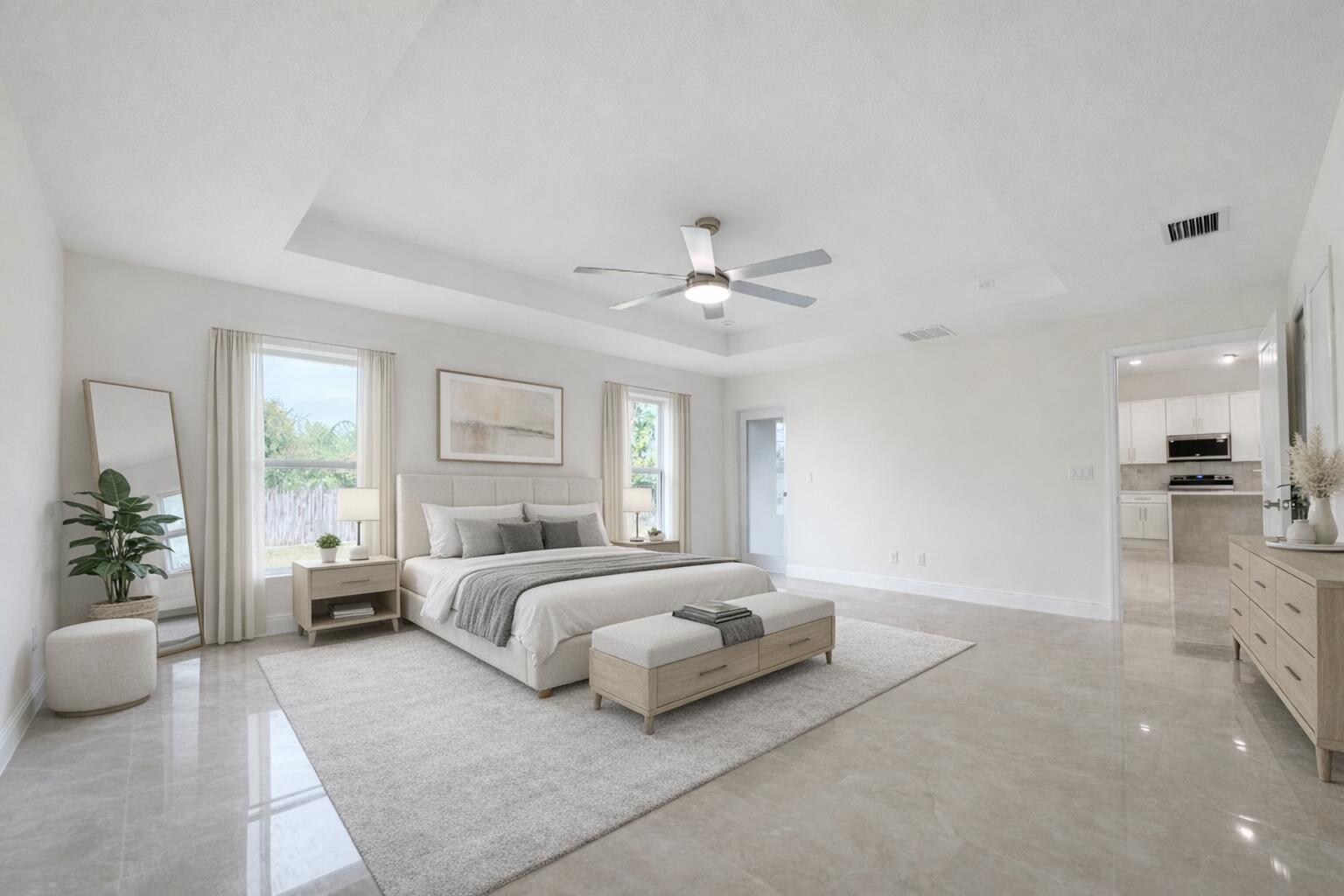 655 Southwest Seagull Terrace Port St. Lucie, FL 34953 - Photo 11 of 24 a bedroom with a large bed and a chandelier