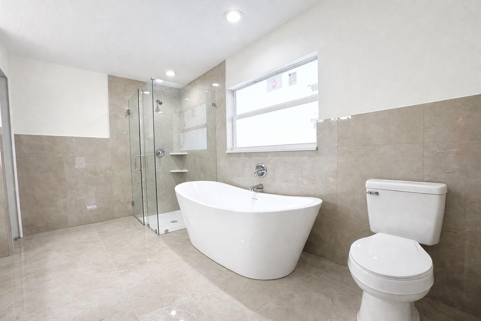 655 Southwest Seagull Terrace Port St. Lucie, FL 34953 - Photo 13 of 24 a bathroom with a sink toilet and shower