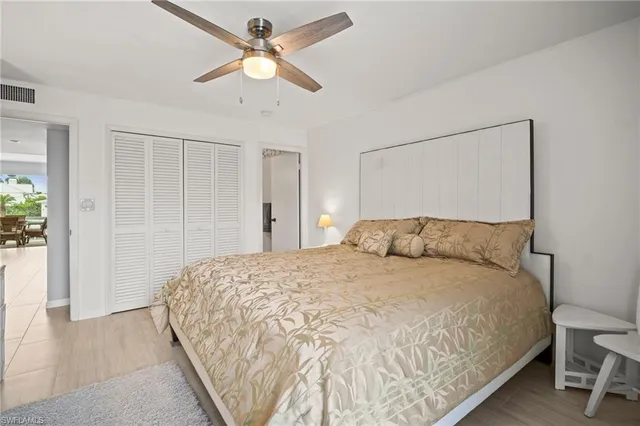 a large bed in a white room