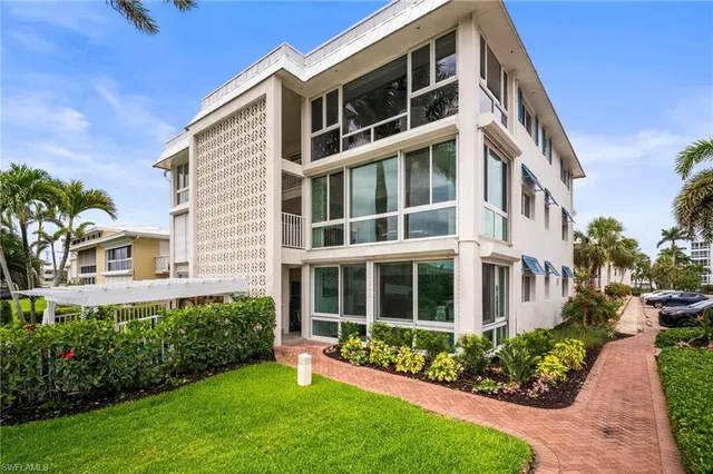 a view of an apartment with a garden