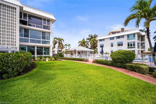 a front view of building with yard