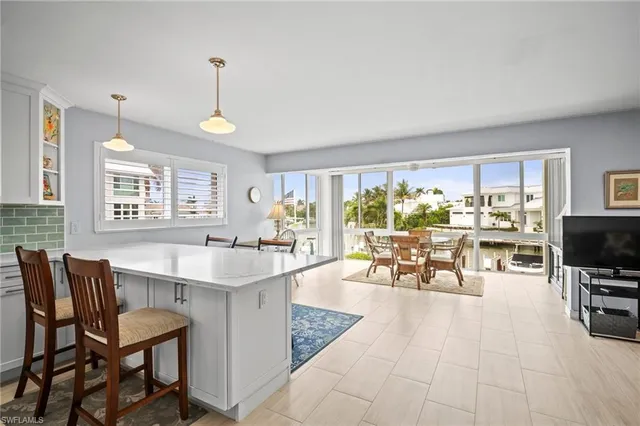 a view of a dining room with furniture window and outside view