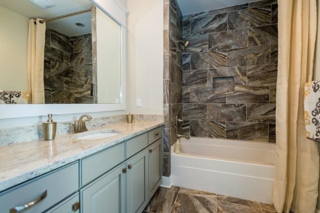 16 Clipper Street Inlet Beach, FL 32461 - Photo 3 of 34 a bathroom with a granite countertop sink toilet and bathtub